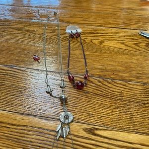 Lia Sophia menagerie necklace with assorted other jewelry pieces.